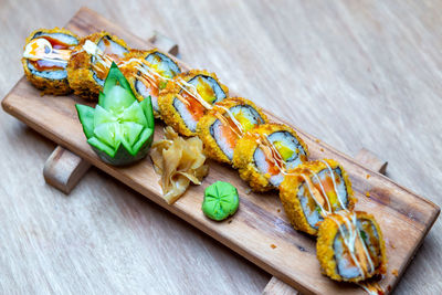 High angle view of sushi on cutting board