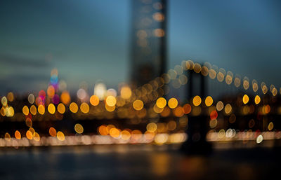 Defocused image of illuminated city at night