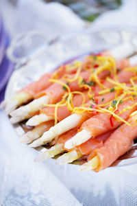 White asparagus wrapped in smoked salmon