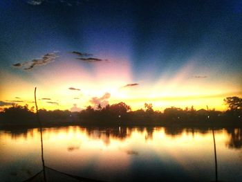 Scenic view of lake at sunset