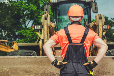 Rear view of engineer working at construction site