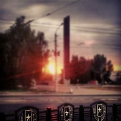 Car on road at sunset