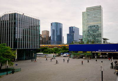 People walking on street in city