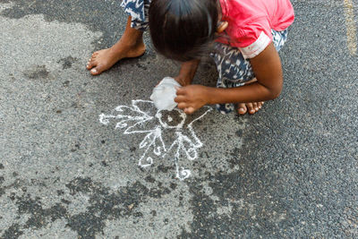 Low section of girl standing on floor