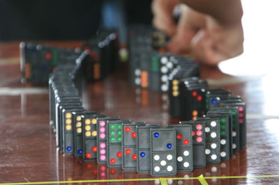Close-up of man playing guitar on table