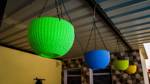 Low angle view of illuminated lanterns hanging on ceiling