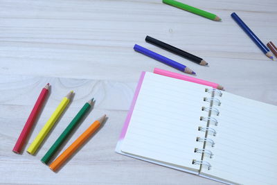 High angle view of colored pencils on table