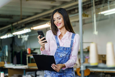 Young woman using mobile phone