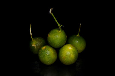 Close-up of fruits against black background