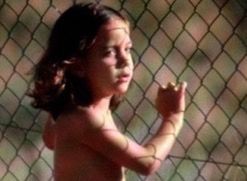 Close-up of hand holding chainlink fence