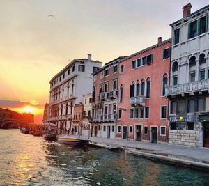 View of buildings in city during sunset