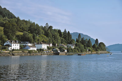 Scenic view of sea and buildings against sky