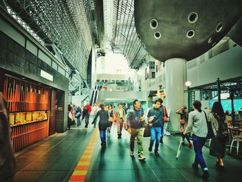 People walking in modern office building