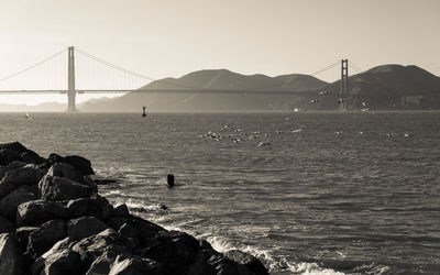 View of suspension bridge over sea