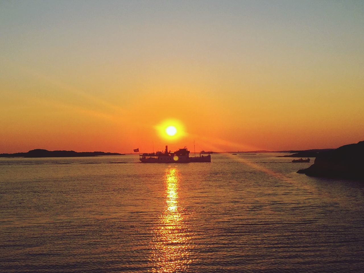 sunset, water, orange color, sun, sea, scenics, tranquil scene, silhouette, beauty in nature, tranquility, waterfront, transportation, idyllic, nautical vessel, nature, reflection, boat, sky, rippled, copy space