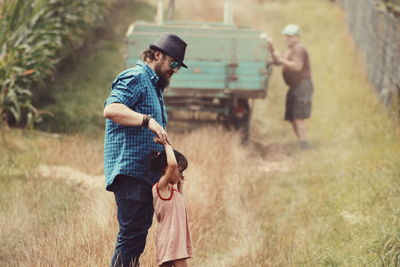 Father with daughter in field