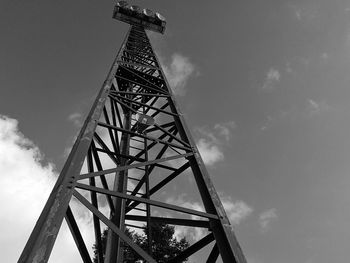 Low angle view of crane against sky