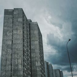 Low angle view of building against cloudy sky