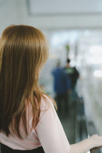 Rear view of woman sitting in hair