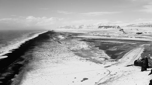 Scenic view of sea against sky during winter