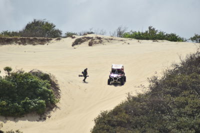 View of tire tracks on sand