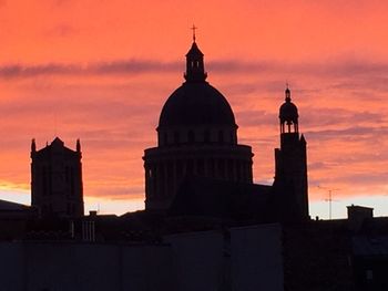 Silhouette cathedral against sky during sunset