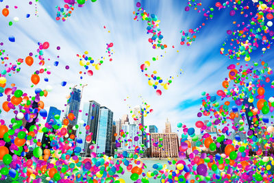 Low angle view of multi colored balloons