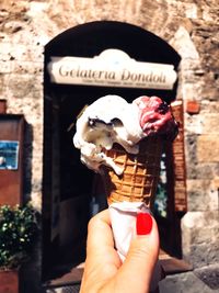 Midsection of person holding ice cream cone