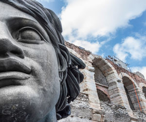 Low angle view of statue of statues against sky