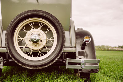 Close-up of vintage car on field