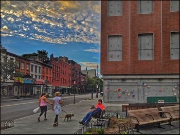 Woman standing on city street