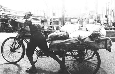 Man riding bicycle on city