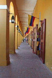 Empty corridor along buildings