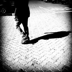 Low section of people walking on road