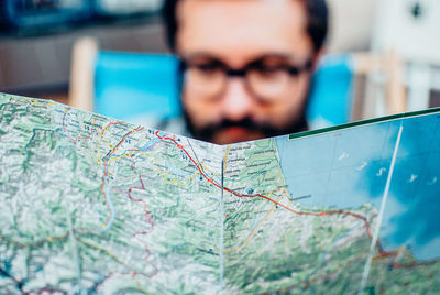 Male tourist holding map