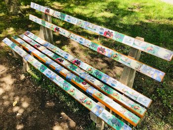 High angle view of park bench on field