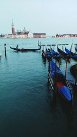 Boats moored in calm sea