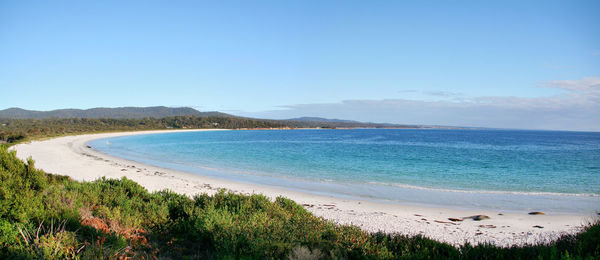 View of beach against blue sky