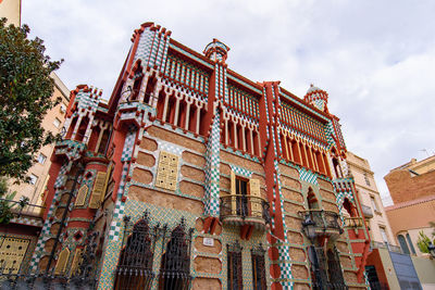 Low angle view of building against cloudy sky