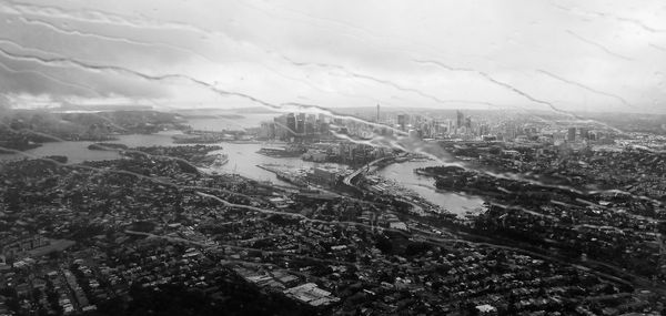 High angle view of city buildings against sky