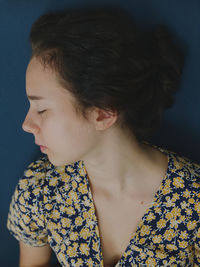 Close-up portrait of girl looking away