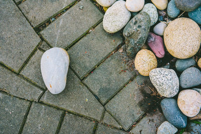 High angle view of stones on footpath