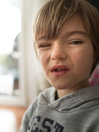 Portrait of boy winking at camera