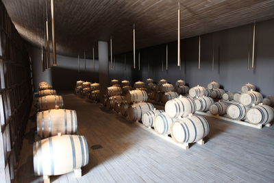 Barrels arranged in wine cellar