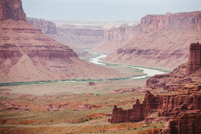 Red sandstone canyon walls and the colorado river near moab utah