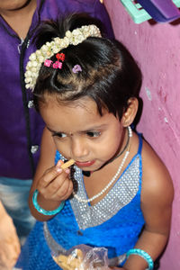 High angle view of cute girl holding baby