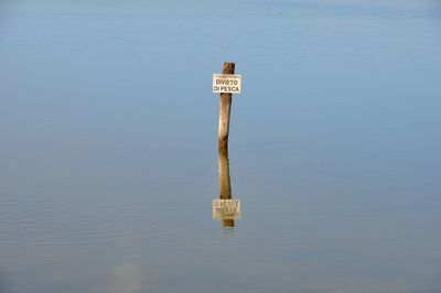 View of sign on a lake