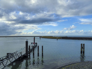 Pier over sea against sky