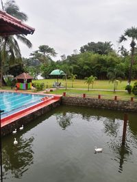 View of swimming pool in lake against sky