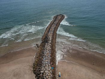 High angle view of surf on beach